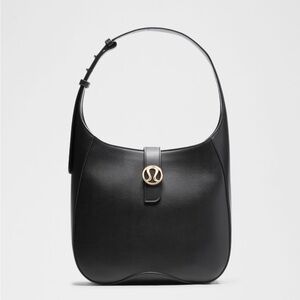 Lululemon Leather Alternative Shoulder Bag 8L- Black/Gold